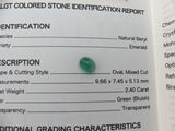 a close up of a piece of green stone on a book