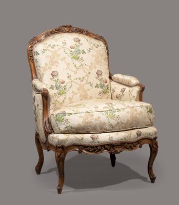 an antique chair with floral upholstered upholstered seat