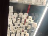 many cards on display in a glass case in a store