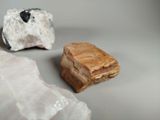 two pieces of rock sitting next to each other on top of a table