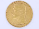 an image of a gold coin with a profile of a man ' s head