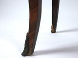 the legs of a wooden table with black legs and a white background