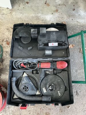 a box with tools in it sitting on the ground