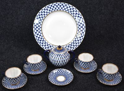 blue and white porcelain tea set with matching cups and saucers