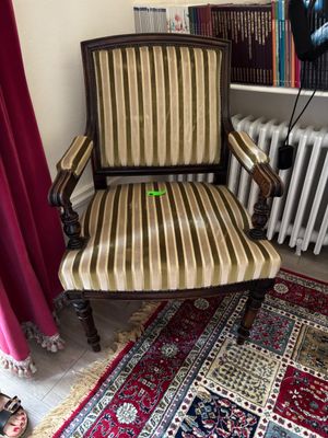 a chair that is sitting in front of a radiator