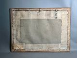 an old picture frame with a piece of newspaper on top of it