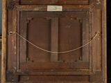 an old wooden easel with a painting on it in a room