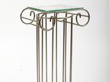 an image of a glass table with a metal frame and a glass top