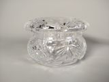 a clear glass jar with a lid on a table