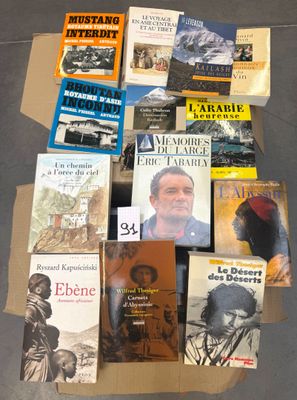 several books are stacked on top of each other on a table