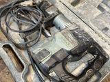 a tool box with tools in it sitting on the floor