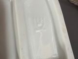 underside of a white porcelain urinal with a hole in the middle