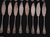 a lot of silver spoons and spoon spoons on a table