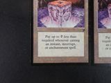 two cards that are sitting on a table