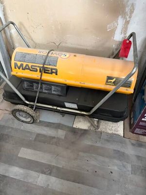 a yellow and black generator on a cart in a room