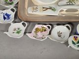 a tray with a tray of tea cups and saucers on it