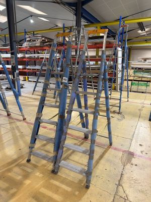 many ladders that are sitting on the floor