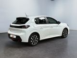 the rear of a white car parked in a room
