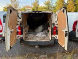 a white van with its doors open in a parking lot