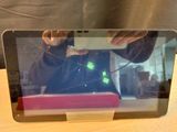 a person taking a picture of a laptop screen
