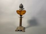 a small oil lamp that is sitting on a table