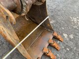 a close up view of a large excavator on the ground