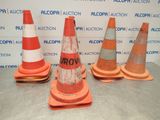 several orange and white traffic cones sitting on top of a table