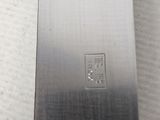 a close up of a knife on a table