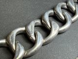 a close up of a metal chain on a table
