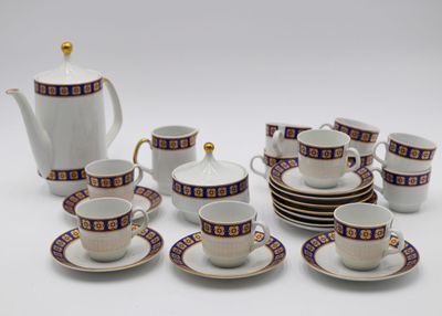 a lot of cups and saucers that are sitting on the table