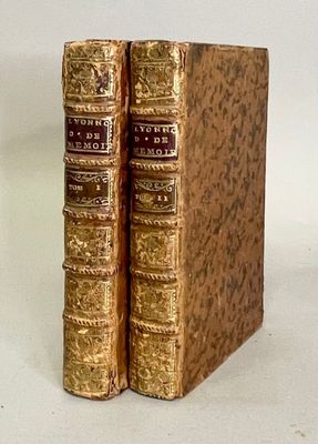 two books that are sitting side by side on a table