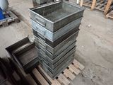 a stack of metal containers on a pallet in a warehouse