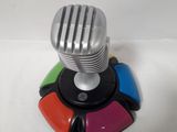 a silver microphone on a stand with a multicolored knob
