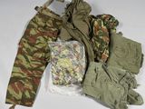 a lot of clothing that is sitting on a table
