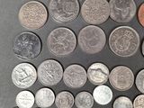 a lot of coins that are on the table