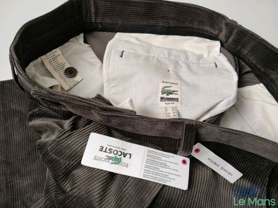 a close up of a brown cordurope jacket with a label on it