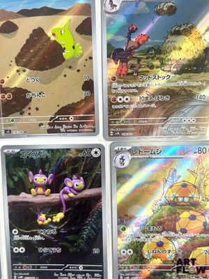 several pokemon cards are displayed on a table in a room
