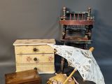 a small collection of antique items on a gray background
