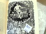 an open book with a drawing of a man on a motorcycle