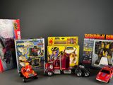 a lot of toy vehicles that are on the table