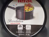 a box of tefal induction frying pans in the store