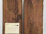 two old wooden frames with a piece of paper attached to them