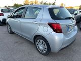 a silver car that is parked in a parking lot