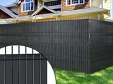 black vinyl fence with a picture of a house in the background