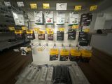 a display of electronics on the wall in a store