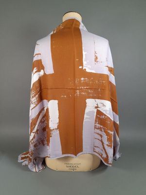 an orange and white scarf on a mannequin mannequin mannequin mannequin mannequin mannequin mannequin mannequin mann