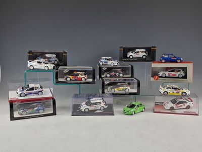 many different models of cars in a display case