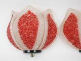 pair of red and white christmas ornament lights on a white surface