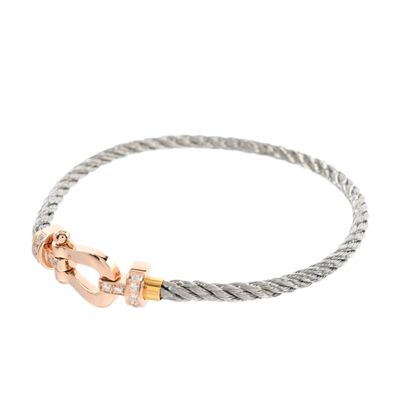 a close up of a bracelet with a clasp on a white background