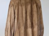an image of a fur coat on a mannequin stand